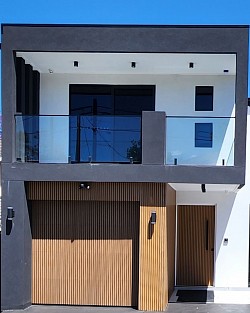 TMC Tinting residential window tinting Sydney — reflective film on newly built two story home building