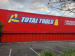TMC Tinting commercial window tinting Sydney — solar control film installed Total Tools retail shopfront