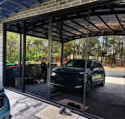 Lkcal based beauty salon with dark glass tinted sliding doors