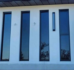 TMC Tinting residential window tinting in bardia Sydney — ceramic privacy film provides night time privacy with minimal viewing inside newly built building facade at front of the home