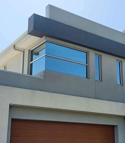 TMC Tinting commercial window tinting Sydney — reflective solar film on commercial building facade